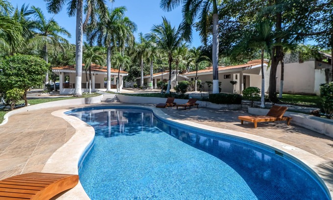 Coco Apartment | Dog-Friendly & Convenient Studio with Shared Pool, Lanai, Water Views