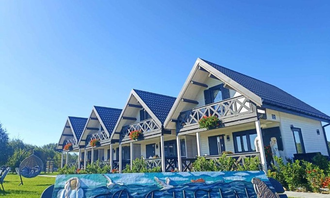 Mielno House | Domki Anielski Zakątek J&R nad Bałtykiem DELUX z balią ogrodową z jacuzzi i klimatyzacją