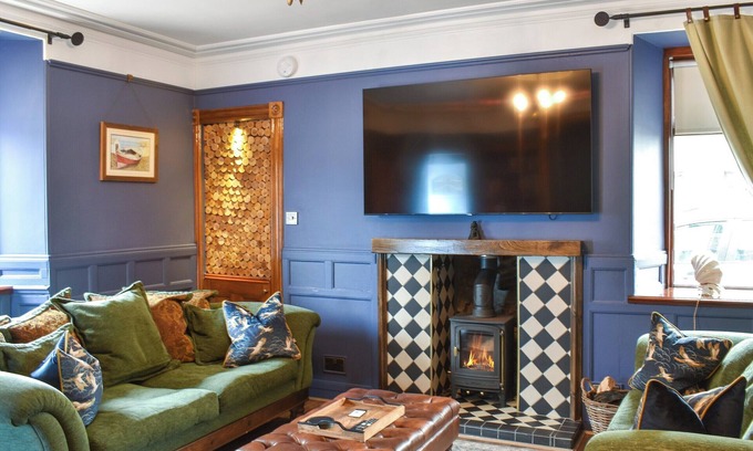 Sandhaven Cottage | Experience cosy comfort in this Cairnbulg holiday home, featuring a log fire.