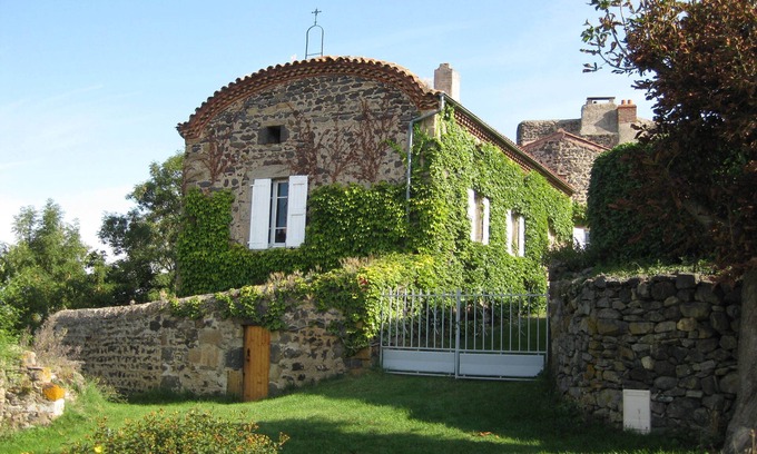 Chalus House | Former priory with garden, located above the village