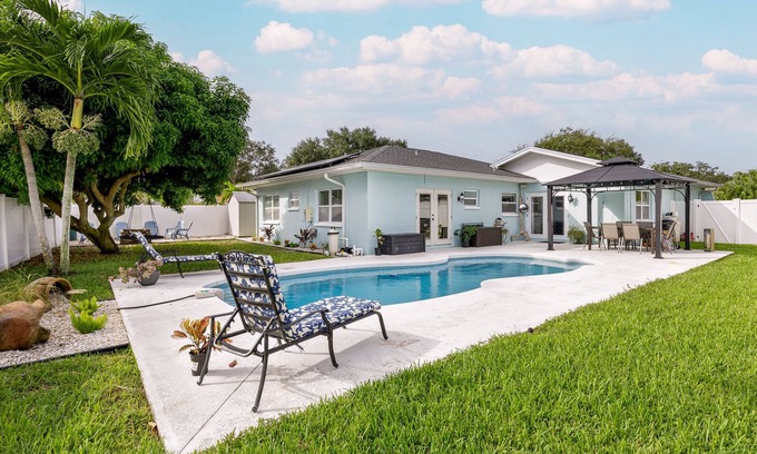Pinellas Park House | FREE Heated Pool Home near the beaches Slps 12 Water Slide Fire Pit