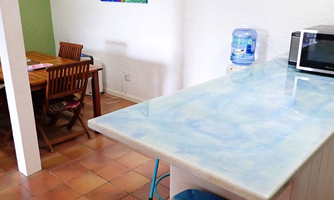 La Grande Princesse Apartment | Hidden by beautiful palm and flamboyant trees but close to restaurants & stores