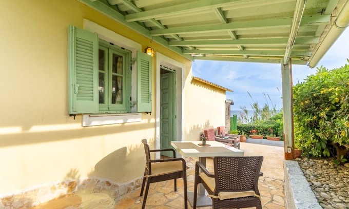 Ag. Georgios House | Holiday Home 'Seafront Studio Stefan' with Sea View, Private Terrace and Air Conditioning