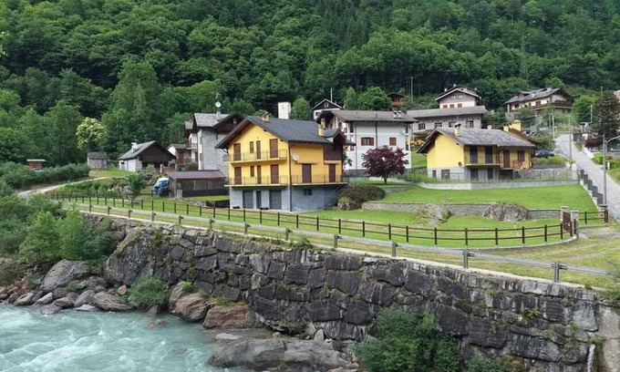 Ceppo Morelli House | Holiday home Situated in a quiet location in the mountains on the edge of the river with a view of the forest