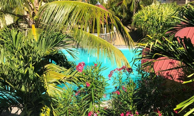 Palmar House | Homerez - Bungalow for 6 ppl. with shared pool, sea view and terrace at Palmar