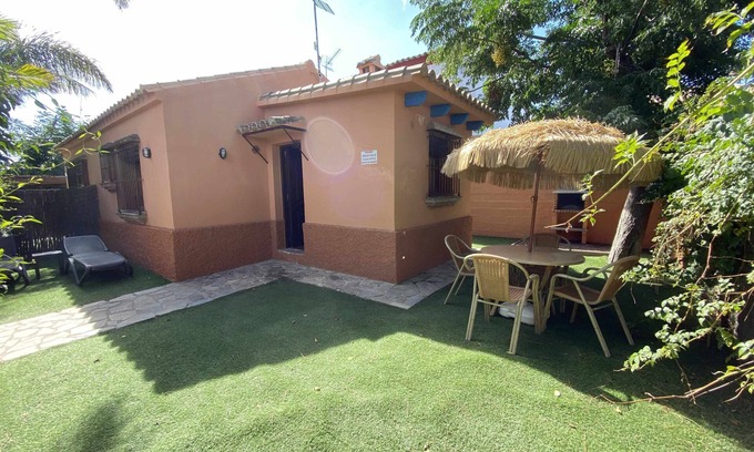 El Palmar House | House/bungalow in tourist complex with private garden and shared pool