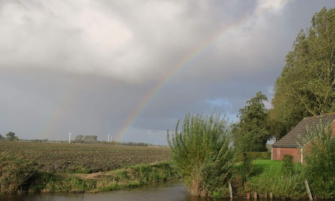 Eilsum House | House on the canal near Greetsiel, rowing boat fishing directly from the jetty, pets allowed