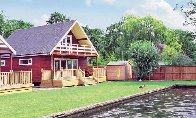Wroxham Cottage | Imagine relaxing on the patio, watching the boats and river life pass by.