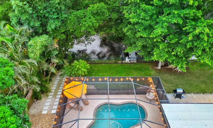 Palma Sola House | Lakefront Escape | Private Dock! Luxurious Pool!