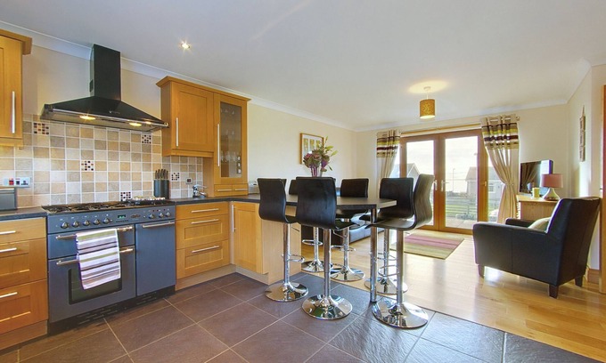 Port William House | Large family sized house, opposite the beach, and pet friendly