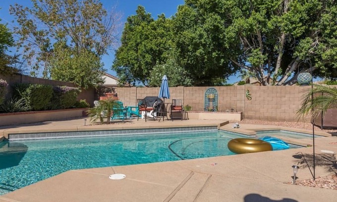 Avondale House | Large oasis, pool heater, spa, putting green