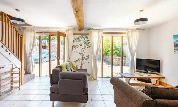 Kemeys Commander Cottage | Light and spacious cottage, with exposed oak beams and floor to ceiling windows
