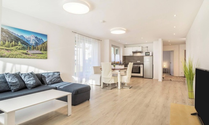 Enzisweiler Apartment | Light-flooded and Modern Apartment “Gartenstraße” with Terraces and Garden
