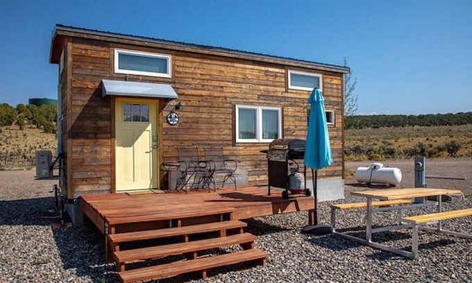 Meeker House | Lion Canyon was built by Mitchcraft in Fort Collins, Colorado as part of HGTV's "Tiny House Hunters". This home has two lofts, each with a Queen bed. One is accessible by stairs and one by ladder.
