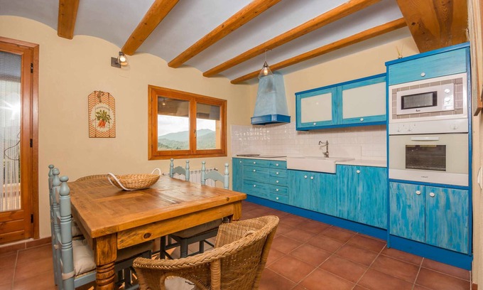 Beceite Apartment | Lo Tossal II. fireplace and terrace