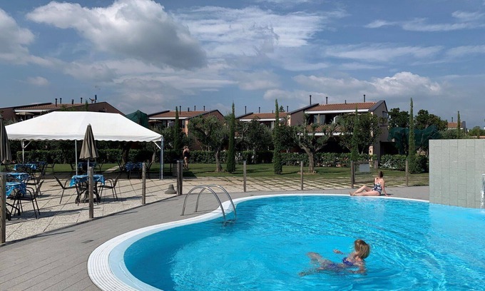 Moniga del Garda Apartment | Lovely apartment for 2 guests with A/C, WIFI, pool, TV, balcony, pets allowed and parking