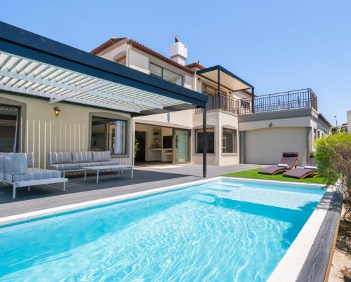 West Beach House | Luxury 5 Bedroom Villa with Heated Pool and Inverter in Blouberg