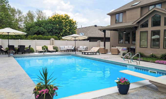 Omaha House | Luxury Home with Heated Saltwater Pool