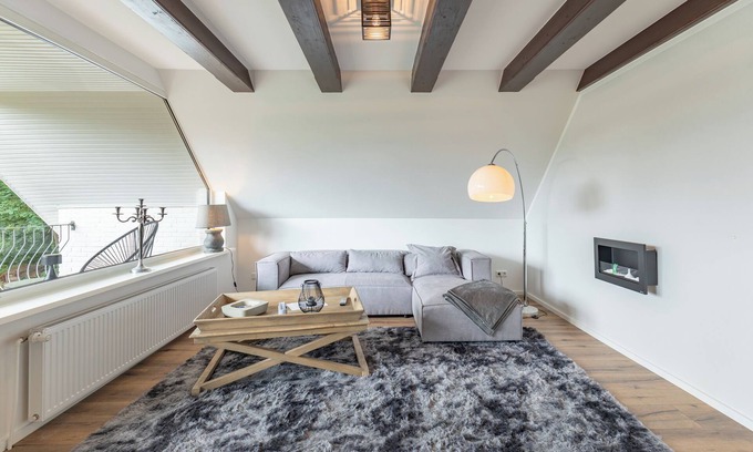 Breklum Apartment | Modern vacation apartment Heimathafen with balcony and garden view in the village of Breklum