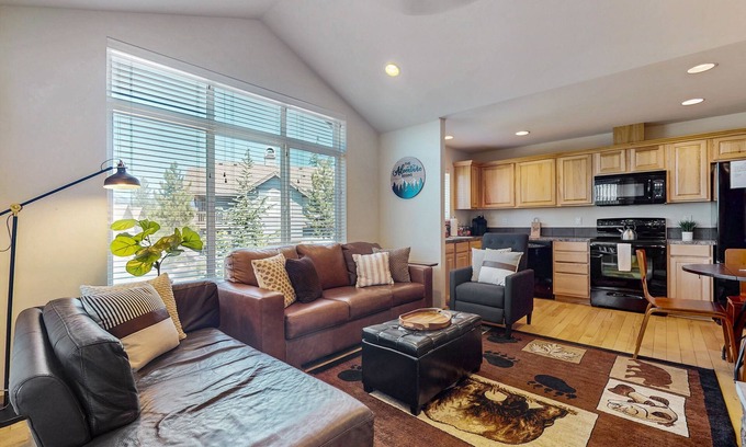 Ronald Condo | Mountain view condo with balcony, fireplace, pool, hot tub, gym & tennis