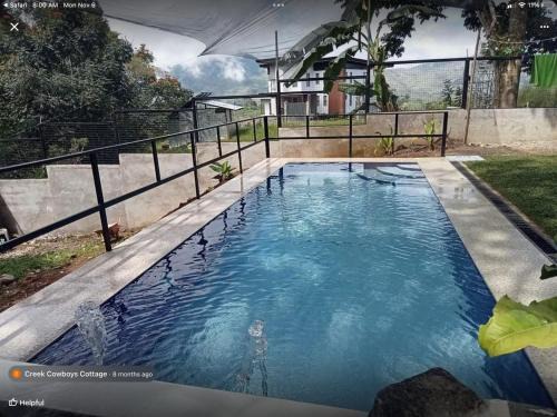 Digos City House | Mt Apo View Creekside Whole house with Pool by Creek Cowboys Cottage