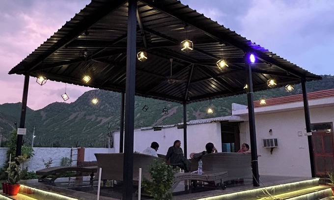 Alwar Other | Nestled amidst majestic mountains, our farmhouse offers a serene and picturesque