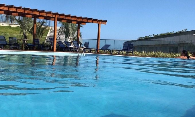 Praia Grande Apartment | New apartment high standard modern sea front building, terrace, beautiful pool.