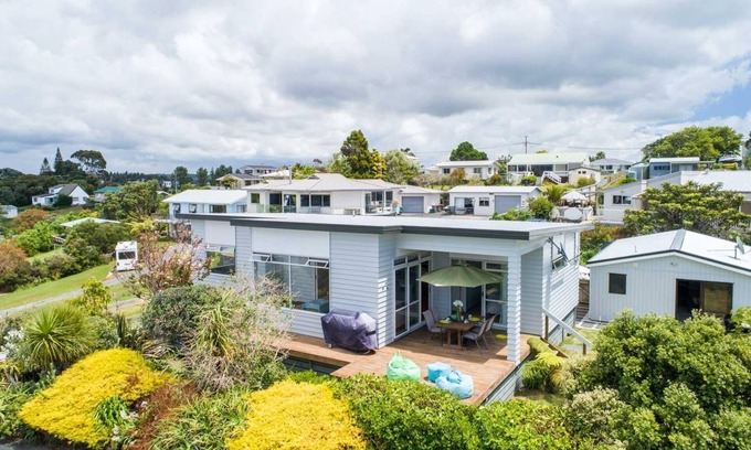 Mangawhai Heads House | Ocean Views - Modern, sunny, pet friendly holiday home only a short walk from the estuary