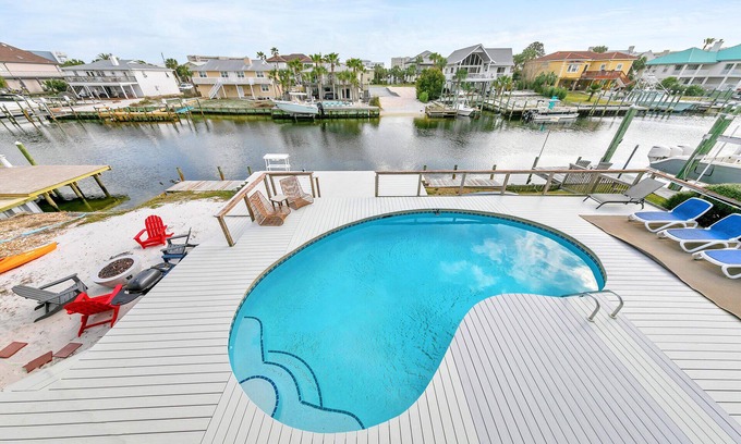 Holiday Isle House | Palm Breeze, boat dock and pool, pet friendly