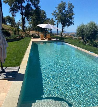 Pancole Villa | PODERE TORRICELLE 69B Pancole Gr, seaview infinity pool, jacuzzi, sauna, exclusive villa with 2 bedrooms for 4 - If you total 5 or 6 people there is an independent suite in main villa with private ensuite bathroom, kitchenette and garden dining area