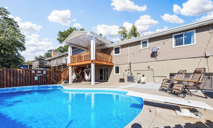 North Central Omaha House | Pool, Sauna, Work out area, ping pong, King Bed. So Many Amenities!