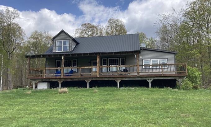 Pawlet House | Post/Beam farmhouse with gorgeous views, a hot tub, no cleaning fees and sheep!