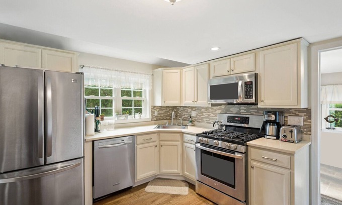 East Quogue House | Private and Peaceful East Quogue Home, Outdoor Entertaining Space with Pool.