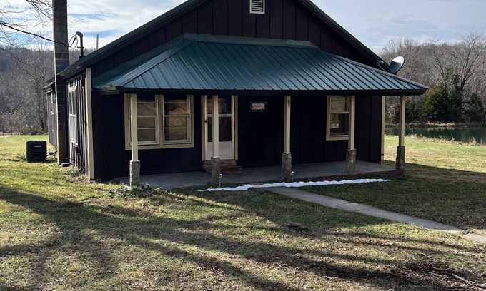 Black Other | Quaint farm house with a small fishing pond.
