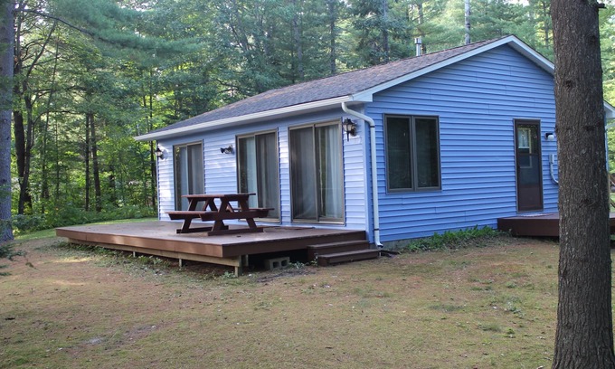 Alger Cabin | Quiet Lakefront Cabin with Private Fire Pit, Beach and Dock