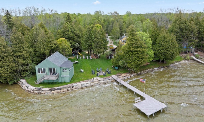 Baileys Harbor Cabin | Right on the water-Dog Friendly Cottage with kids playground