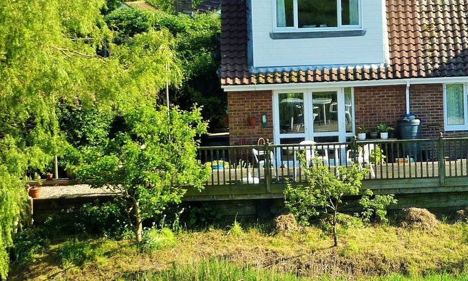 Icklesham Ski Chalet | River Fronted Self Contained Annex With Panoramic Views in a peaceful location.