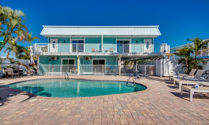 South Island House | Sand Dollar #1 - Downstairs Apt with Shared Pool on Canal by the Beach!