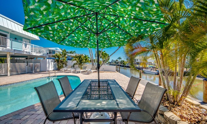 South Island House | Sand Dollar #4 - Upstairs Apt with shared Pool on Canal by the Beach!