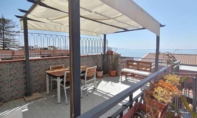 Roccalumera Apartment | Seafront, attic room with terrace.
