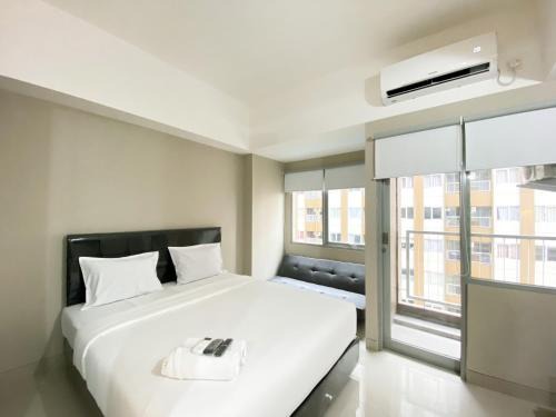 Duren Sawit Apartment | Simply Studio Room Gateway Park LRT City Jatibening Apartment By Travelio