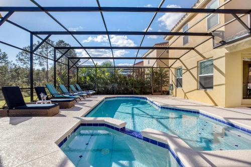 Watersong Villa | Spacious 6-Bedroom Getaway with Game Room, Private Spa & Sunny Pool Deck in Premier Resort Setting