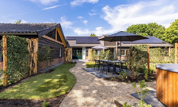 Municipality of Ede House | Spacious 6-person home with a private hot tub in the garden. Stylish, single-floor layout with all modern comforts.