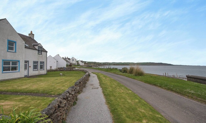 Drummore Cottage | Spacious family cottage with open fire and garden overlooking the sea.