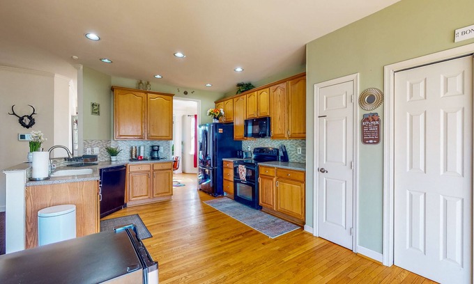 Sykesville House | Spacious home with enclosed yard, deck, children's items, full kitchen, & W/D