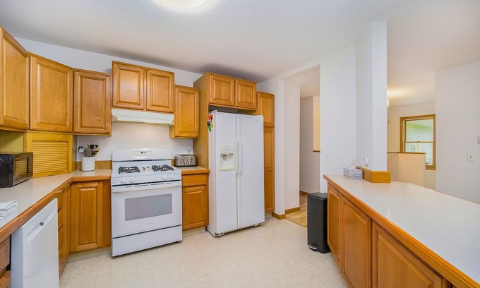 Bay Harbor House | Spacious home with fireplace, full kitchen, central AC, & washer/dryer