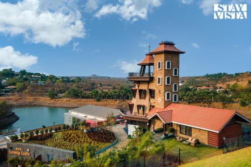 Anjaneri Villa | StayVista's Cerenity Castle - Lakeside Haven with Hill-View, Terrace & Indoor Entertainment
