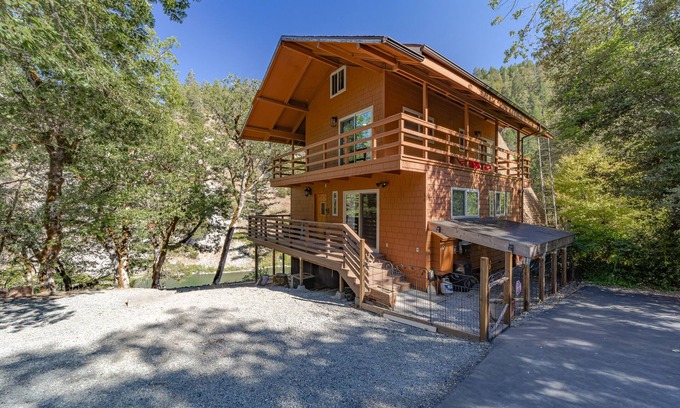 Salyer House | Stunning riverfront gem w/wraparound deck, beach access & game room