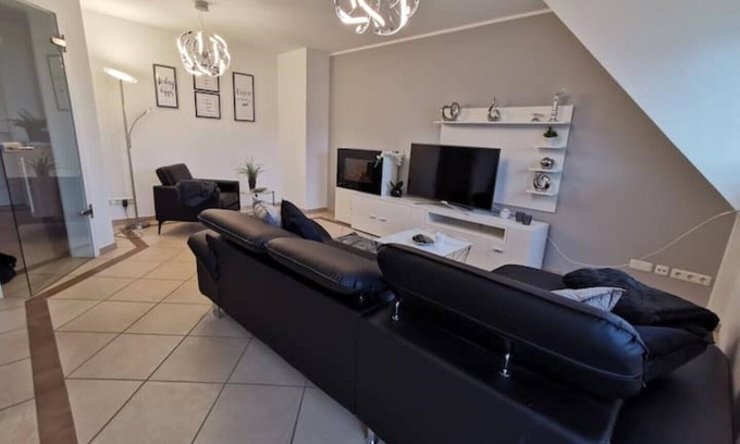 Bad Essen Apartment | The modern Welness apartment is located in Bad Essen with a view of the Wiehengebirge mountains.