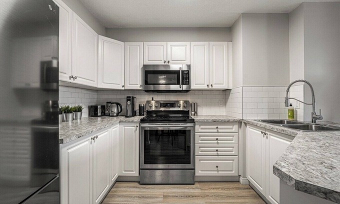 Okotoks Apartment | The Penthouse Balcony Fire Pit BBQ A/C